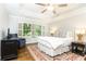 Well-appointed main bedroom featuring hardwood floors, neutral tones, and abundant natural light at 2197 Fairway Ne Cir, Brookhaven, GA 30319