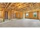 Unfinished basement with framing ready for customization, offering potential for added living space at 2340 Manor Pointe Dr, Cumming, GA 30041
