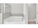Bathroom featuring sleek tub and shower at 2340 Manor Pointe Dr, Cumming, GA 30041