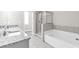 Bathroom boasts double vanity, shower and tub at 2340 Manor Pointe Dr, Cumming, GA 30041