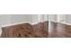 Large bedroom with hardwood flooring, base trim and neutral color palette at 2340 Manor Pointe Dr, Cumming, GA 30041