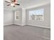 Spacious carpeted bedroom with natural light and ceiling fan at 2340 Manor Pointe Dr, Cumming, GA 30041