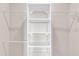 This walk-in closet features adjustable shelving and rods for customizable storage solutions at 2340 Manor Pointe Dr, Cumming, GA 30041