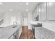 Spacious kitchen with granite countertops, stainless steel appliances and stylish gray cabinetry at 2340 Manor Pointe Dr, Cumming, GA 30041