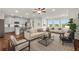Inviting living room with modern furniture and an open layout, with a bright kitchen at 2340 Manor Pointe Dr, Cumming, GA 30041