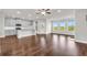Spacious living area with hardwood floors and a kitchen with white cabinets at 2340 Manor Pointe Dr, Cumming, GA 30041