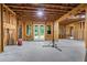 Unfinished basement with wooden framing and door to yard is ready to be customized to your needs at 241 Russell Rd, Lawrenceville, GA 30043