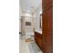 Bathroom features white cabinets, dual vanity, and a shower with decorative tile at 241 Russell Rd, Lawrenceville, GA 30043