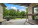 Enjoy a relaxing afternoon on this well-appointed deck with a swing and views of the natural landscape at 241 Russell Rd, Lawrenceville, GA 30043