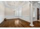 This expansive dining room features elegant molding, trim and plantation shutters at 241 Russell Rd, Lawrenceville, GA 30043