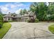 Front exterior of home shows circular drive and basketball goal at 241 Russell Rd, Lawrenceville, GA 30043