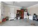 Spacious garage features ample storage space with white door and painted concrete flooring at 241 Russell Rd, Lawrenceville, GA 30043