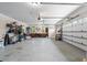 Spacious three-car garage offers generous storage and parking with bright overhead lighting at 241 Russell Rd, Lawrenceville, GA 30043