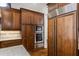 Gourmet kitchen features built-in stainless steel appliances, custom cabinetry, and a hidden pantry at 241 Russell Rd, Lawrenceville, GA 30043