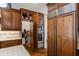 This gourmet kitchen boasts built-in stainless steel appliances, custom cabinetry, and a hidden pantry at 241 Russell Rd, Lawrenceville, GA 30043