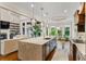 Open concept kitchen with a large island and seamlessly connects to the living area at 241 Russell Rd, Lawrenceville, GA 30043