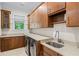 This functional laundry room boasts lots of storage and modern appliances at 241 Russell Rd, Lawrenceville, GA 30043