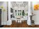 Bright living room featuring coffered ceilings, large windows, fireplace, and hardwood floors at 241 Russell Rd, Lawrenceville, GA 30043