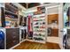 This custom walk-in closet features custom shelving and hardwood floors at 241 Russell Rd, Lawrenceville, GA 30043
