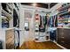 This spacious walk-in closet has custom shelving and storage options at 241 Russell Rd, Lawrenceville, GA 30043