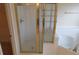 This is a close up of a tiled walk-in shower with glass doors at 804 Bridle Cove, Stockbridge, GA 30281