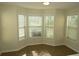 Bright breakfast nook featuring tile flooring and multiple windows with natural light at 804 Bridle Cove, Stockbridge, GA 30281