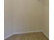 This walk-in closet has neutral walls, neutral carpeting, and white trim at 804 Bridle Cove, Stockbridge, GA 30281