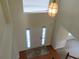 Bright foyer with a hanging light fixture and tile flooring at 804 Bridle Cove, Stockbridge, GA 30281
