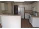 Functional kitchen with white appliances and tile flooring at 804 Bridle Cove, Stockbridge, GA 30281
