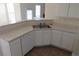 Corner kitchen featuring tile floors, sink, and dishwasher at 804 Bridle Cove, Stockbridge, GA 30281