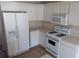 Clean kitchen with white cabinets and basic appliances at 804 Bridle Cove, Stockbridge, GA 30281