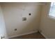 Small laundry room includes tile flooring, washer/dryer hookups, and wire rack shelving at 804 Bridle Cove, Stockbridge, GA 30281