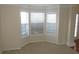 Bright living room with a bay window and neutral carpet at 804 Bridle Cove, Stockbridge, GA 30281