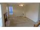 Living room with a ceiling fan, fireplace and neutral carpeting throughout at 804 Bridle Cove, Stockbridge, GA 30281