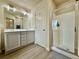 Full bathroom with a glass enclosed shower and double vanity at 2351 Attewood Dr, Buford, GA 30519