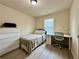 Bedroom with neutral decor and an efficient desk area at 2351 Attewood Dr, Buford, GA 30519