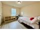 Comfortable bedroom with a functional desk, shelving, and natural light at 2351 Attewood Dr, Buford, GA 30519
