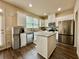 Updated kitchen featuring stainless steel appliances, granite countertops, and a center island at 2351 Attewood Dr, Buford, GA 30519