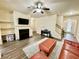 Comfortable living room includes a fireplace, media center and stairs to upper level at 2351 Attewood Dr, Buford, GA 30519