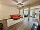 Bright living room featuring hardwood floors, an area rug, and open access to the kitchen at 2351 Attewood Dr, Buford, GA 30519
