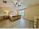 Spacious main bedroom featuring a ceiling fan and hardwood floors at 2351 Attewood Dr, Buford, GA 30519
