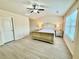 Bright main bedroom with large window and stylish ceiling fan at 2351 Attewood Dr, Buford, GA 30519