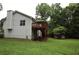 Spacious backyard with a deck, a small outbuilding, and green landscaping at 236 Hiram Sudie Rd, Dallas, GA 30157