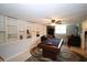 Basement features a finished living area with a pool table, built-in shelving, and a cozy seating arrangement at 236 Hiram Sudie Rd, Dallas, GA 30157