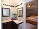 Dual sink bathroom with a bedroom view at 236 Hiram Sudie Rd, Dallas, GA 30157