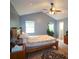 Bright bedroom with a ceiling fan, a large bed, and big windows that let in natural light at 236 Hiram Sudie Rd, Dallas, GA 30157