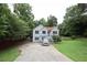 Inviting home with a long driveway, well-manicured lawn, and mature trees, offering a serene setting at 236 Hiram Sudie Rd, Dallas, GA 30157
