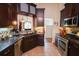 Stylish kitchen featuring stainless steel appliances, tile backsplash, and ample countertop space at 236 Hiram Sudie Rd, Dallas, GA 30157