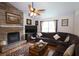 Cozy living room with a stone fireplace, plush sofa, and warm lighting for a relaxing atmosphere at 236 Hiram Sudie Rd, Dallas, GA 30157