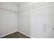 A well-lit walk in closet with ample storage space at 2840 Brookford Sw Ln, Atlanta, GA 30331